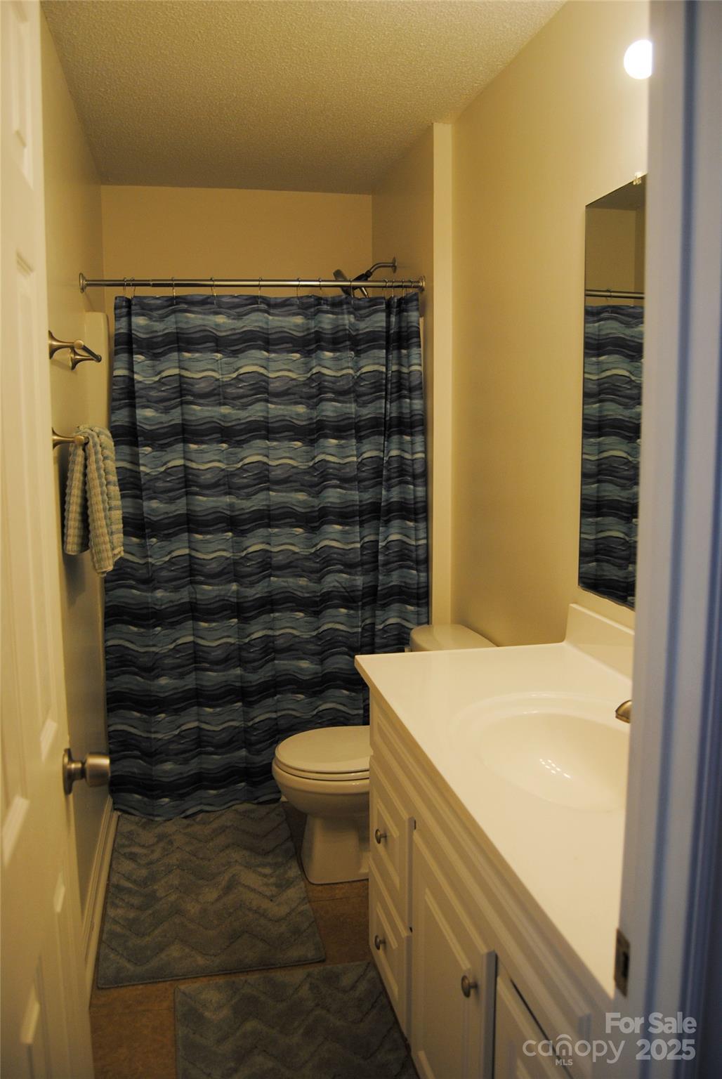2191 Pacer Road Lancaster, SC 29720 - Photo 12 of 15 a bathroom with a granite countertop toilet and sink