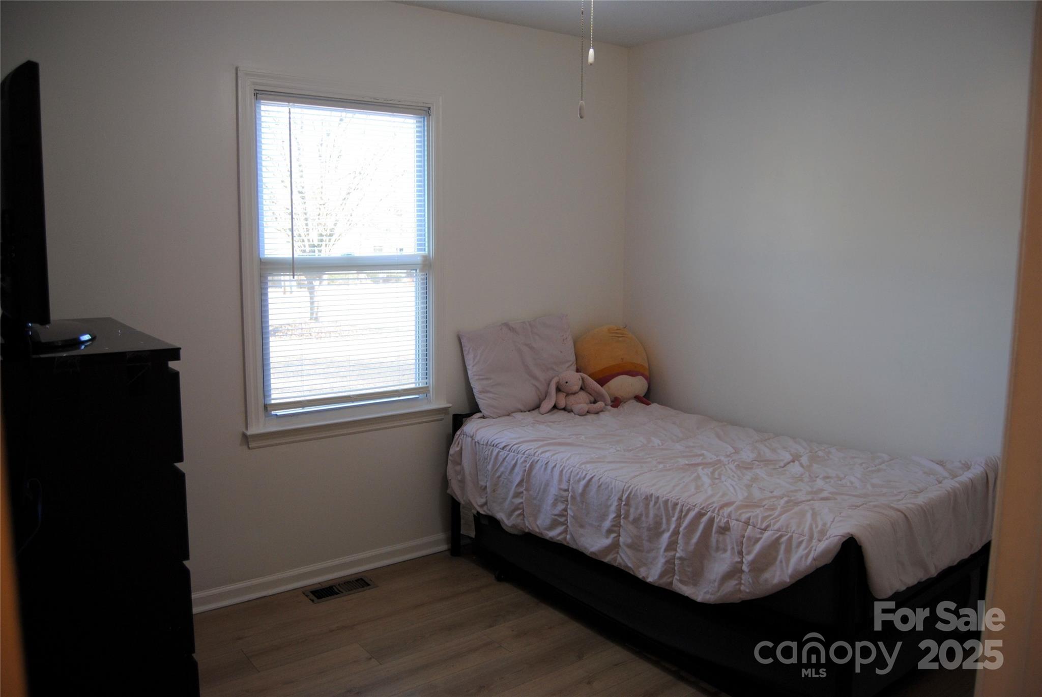 2191 Pacer Road Lancaster, SC 29720 - Photo 13 of 15 a bedroom with a bed and wooden floor