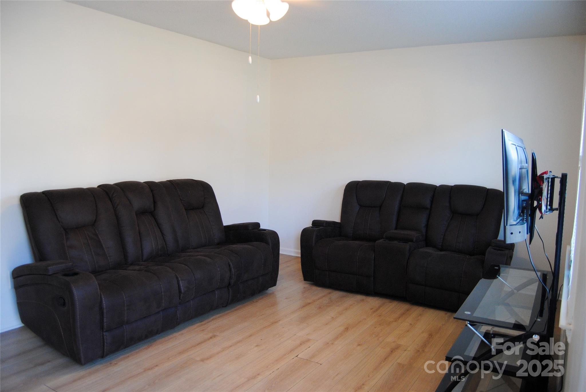 2191 Pacer Road Lancaster, SC 29720 - Photo 7 of 15 a living room with couches and a flat screen tv
