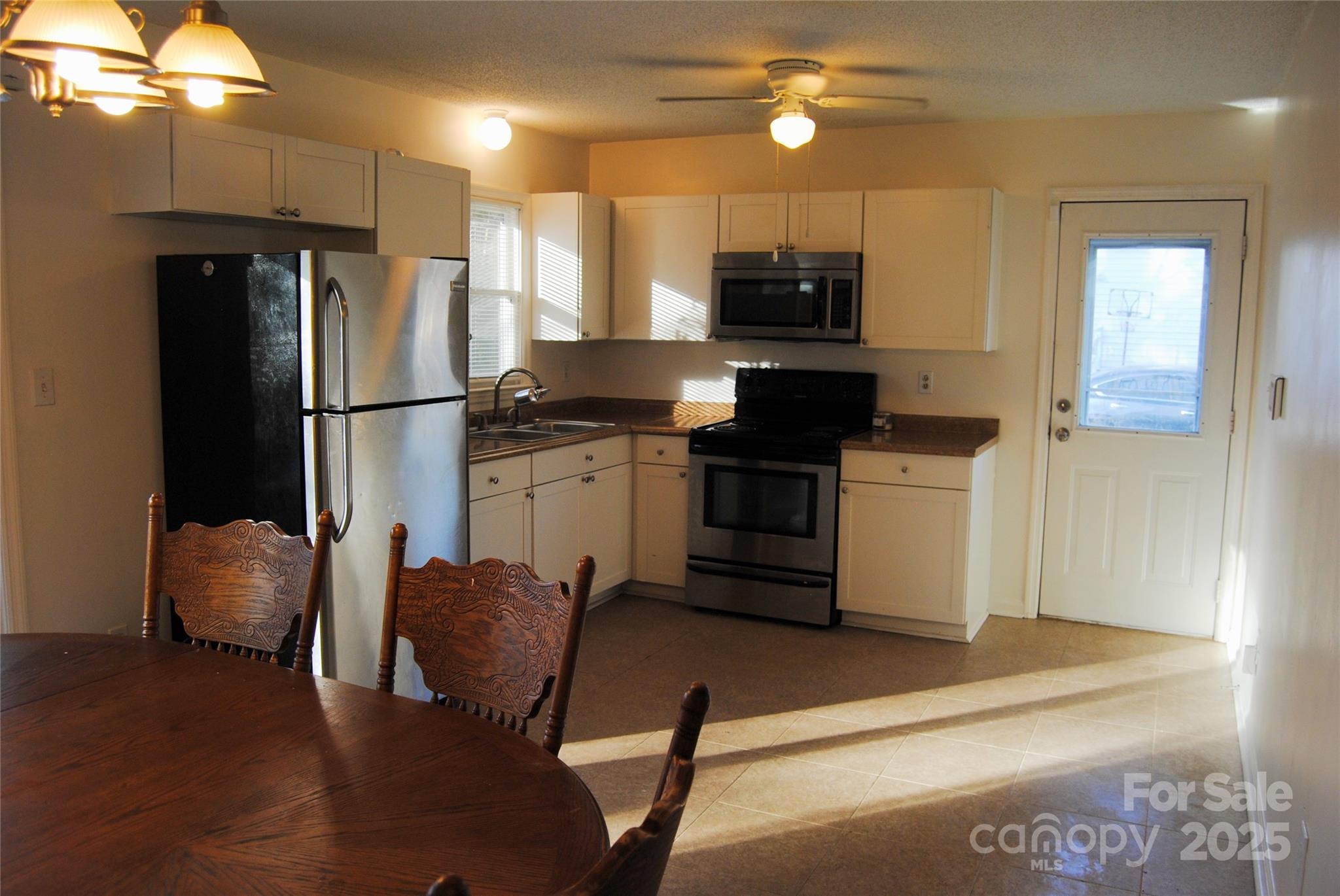 2191 Pacer Road Lancaster, SC 29720 - Photo 9 of 15 a kitchen with stainless steel appliances a refrigerator stove microwave and sink