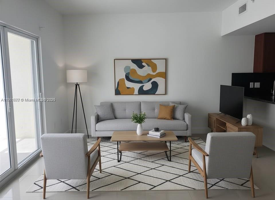 1020 Southwest 4th Street, Unit 106 Miami, FL 33130 - Photo 1 of 10 a living room with furniture a rug and a window