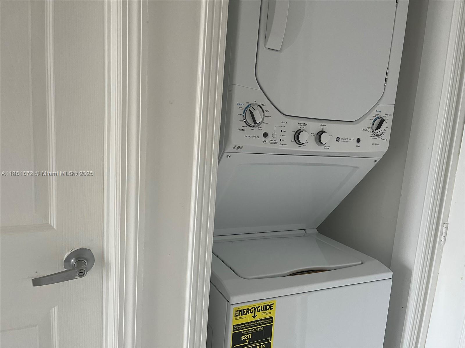 1020 Southwest 4th Street, Unit 106 Miami, FL 33130 - Photo 8 of 10 a utility room with dryer and washer