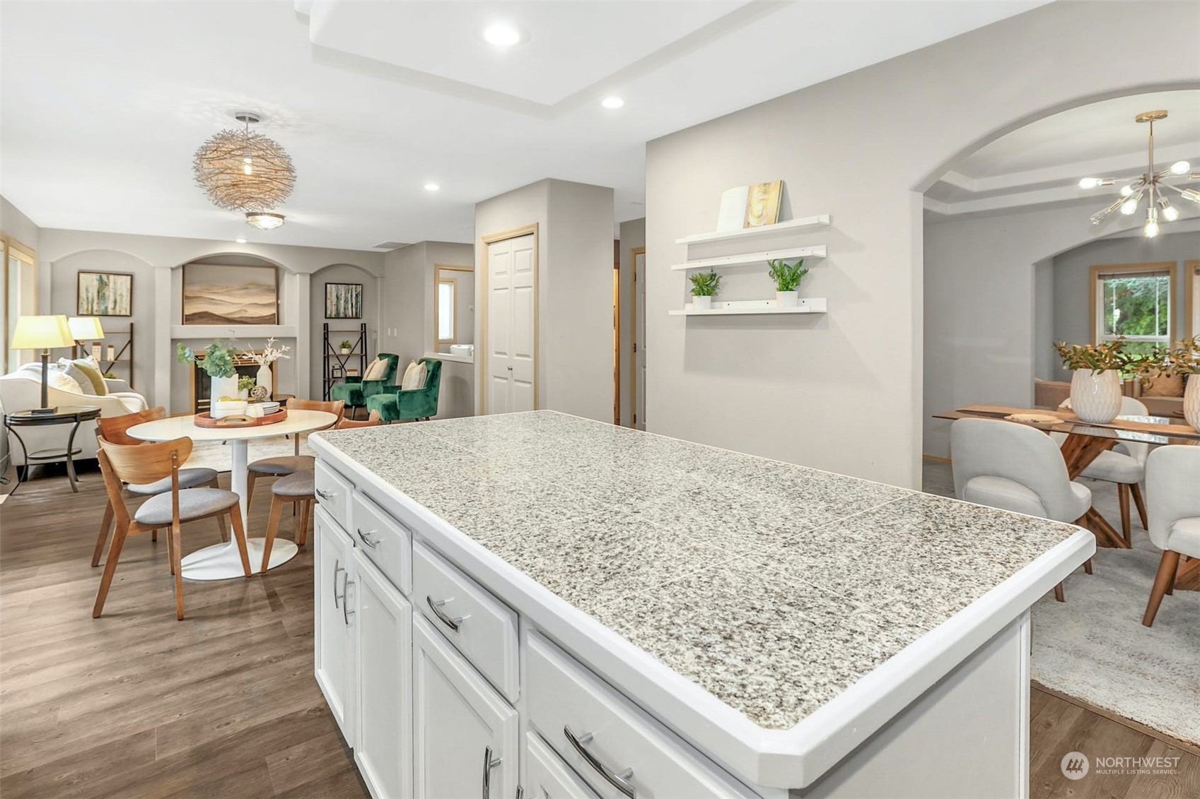 10413 Southeast 186th Place Renton, WA 98055 - Photo 13 of 34 a view of kitchen island sink and living room