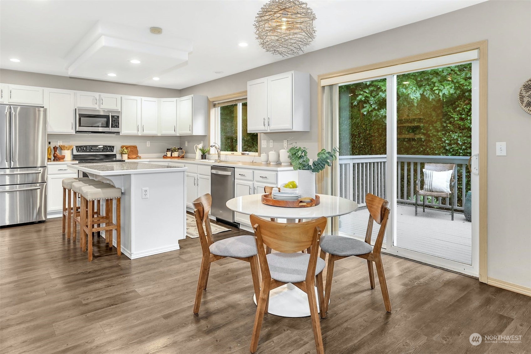10413 Southeast 186th Place Renton, WA 98055 - Photo 14 of 34 a view of a dining room with furniture and wooden floor