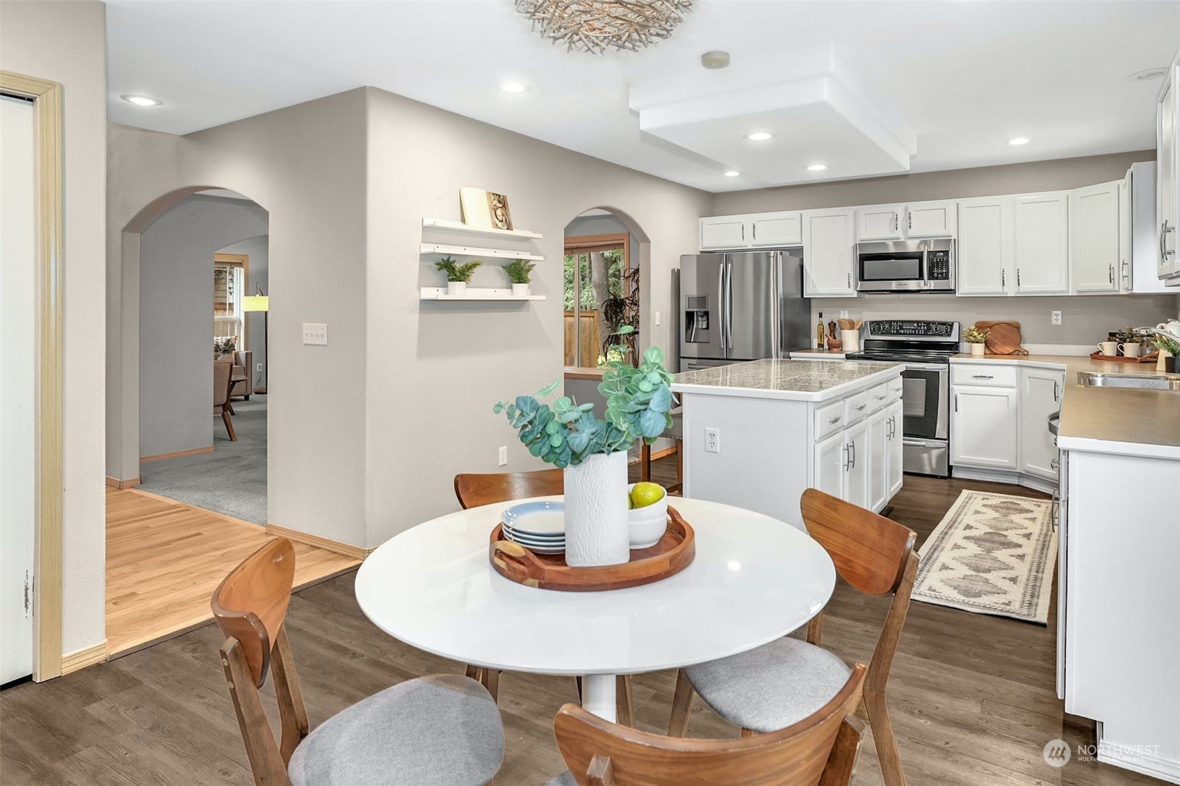 10413 Southeast 186th Place Renton, WA 98055 - Photo 15 of 34 a kitchen with a dining table and chairs