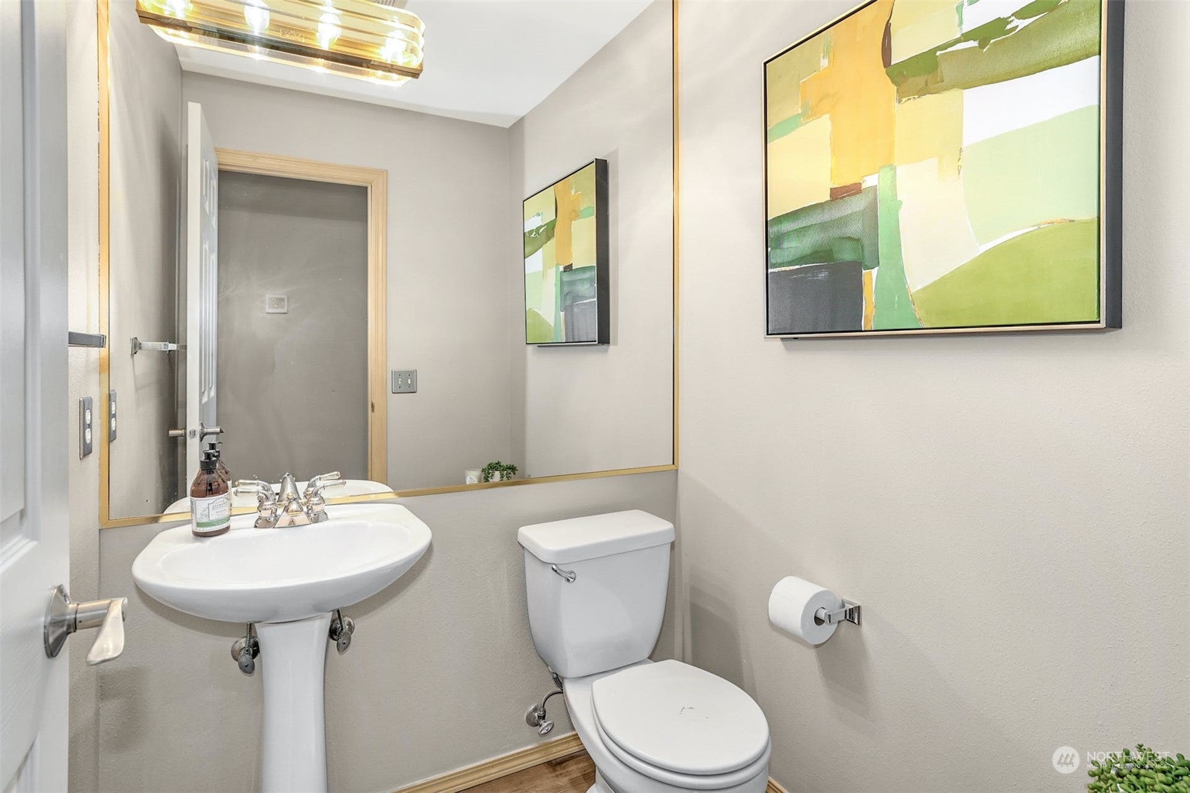 10413 Southeast 186th Place Renton, WA 98055 - Photo 19 of 34 a bathroom with a toilet sink and mirror