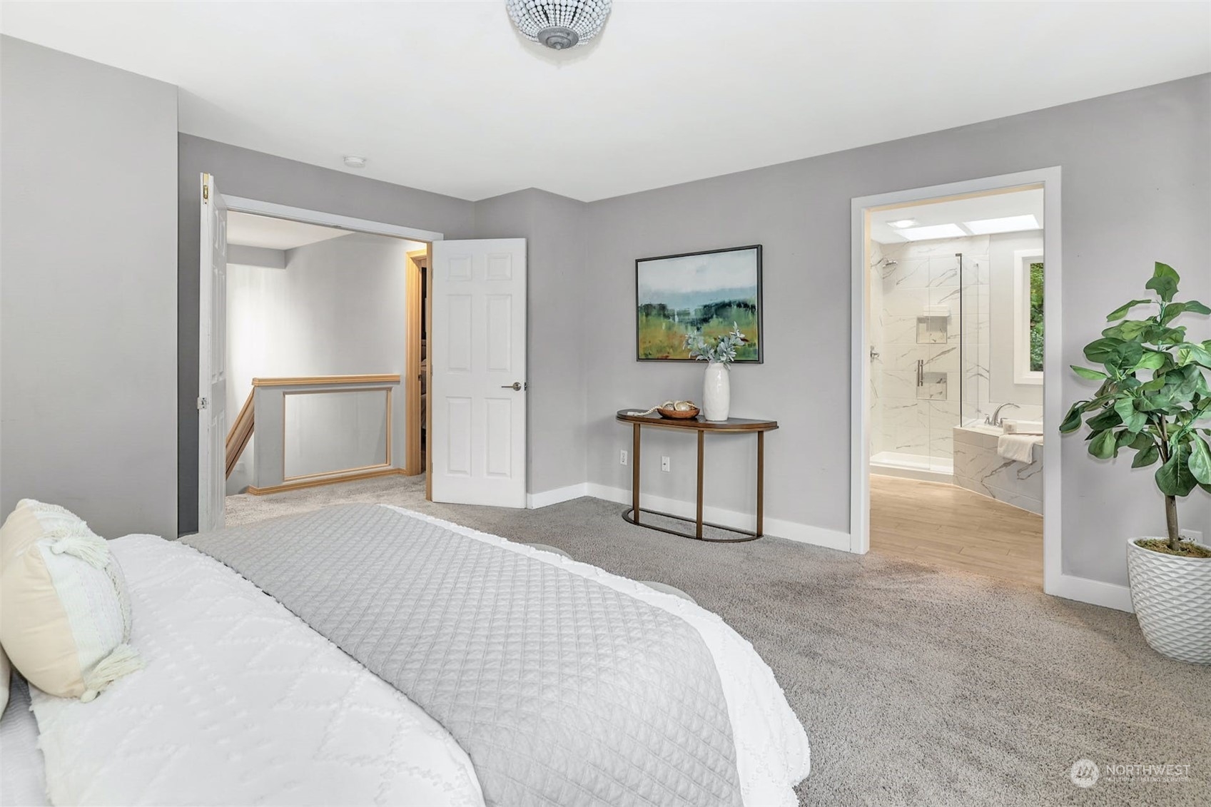 10413 Southeast 186th Place Renton, WA 98055 - Photo 21 of 34 a bedroom with a bed and a potted plant