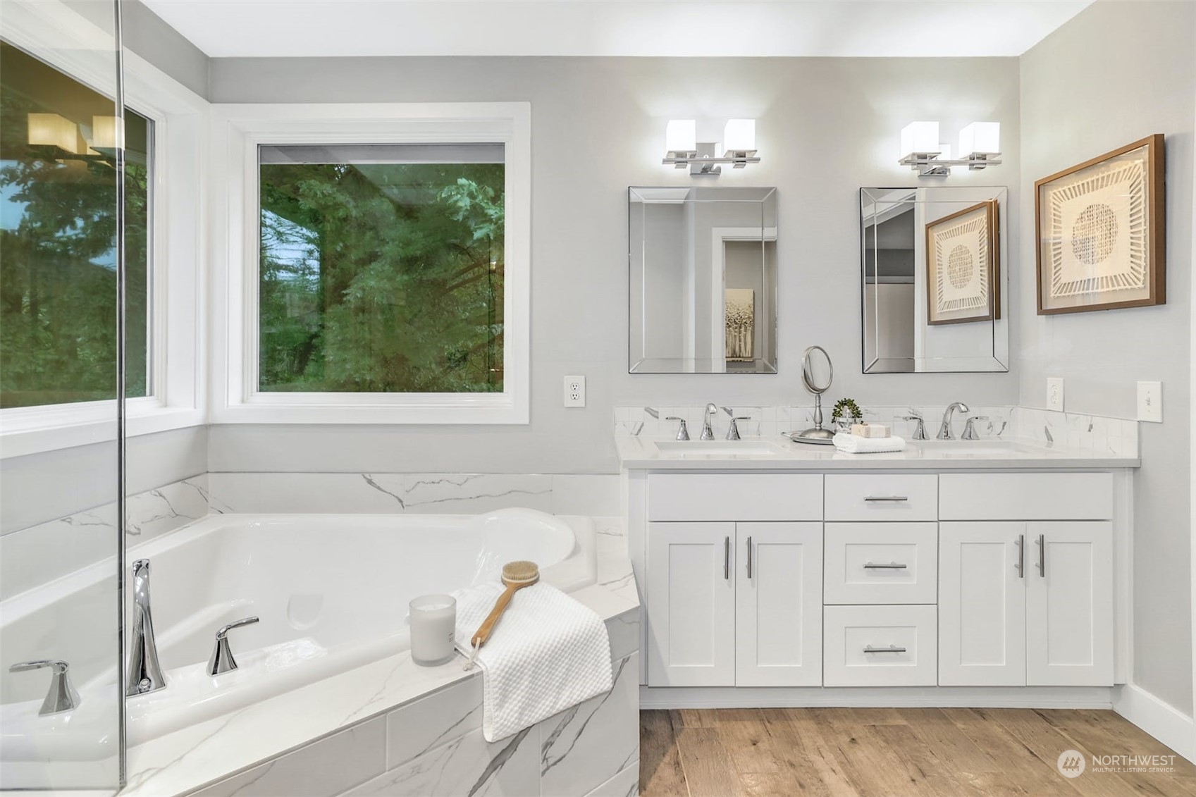 10413 Southeast 186th Place Renton, WA 98055 - Photo 23 of 34 a bathroom with a tub a sink and mirror