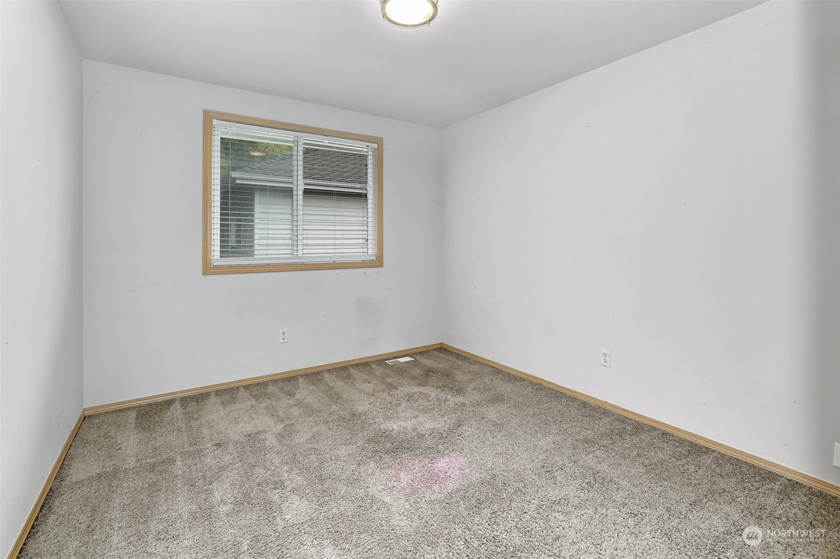 10413 Southeast 186th Place Renton, WA 98055 - Photo 27 of 34 an empty room with a window