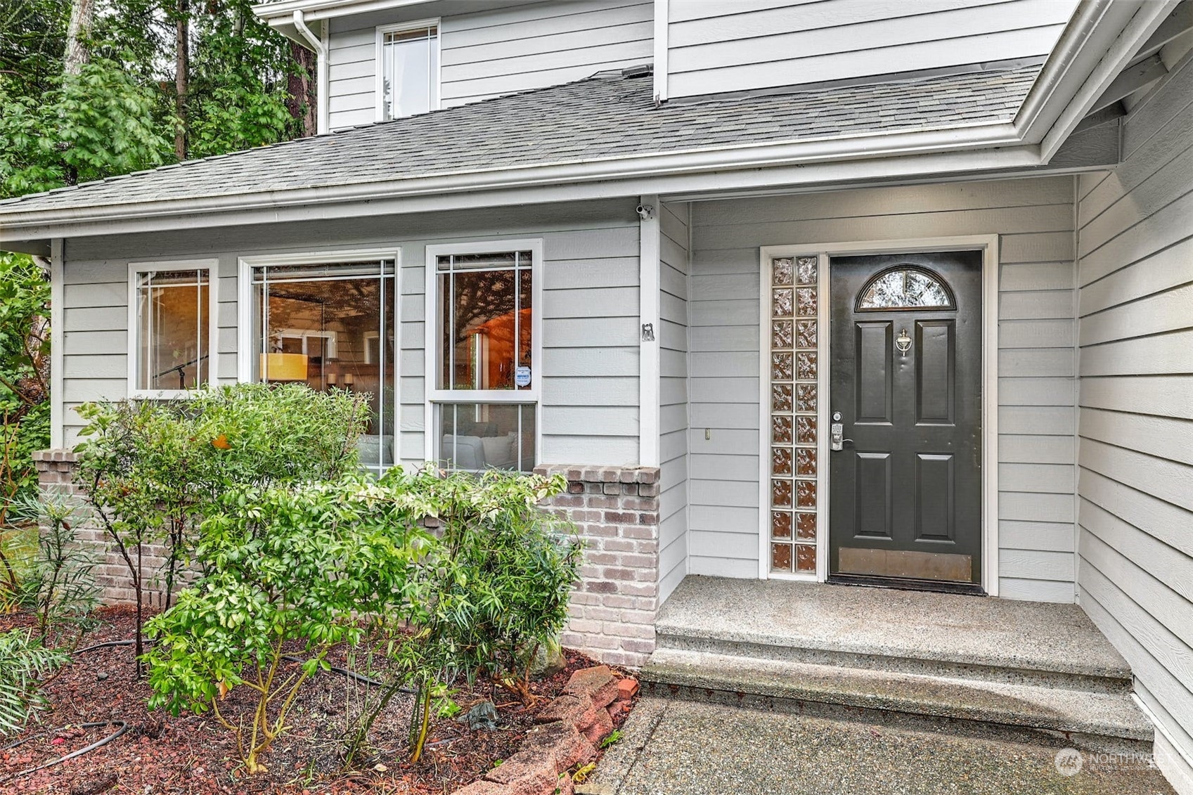 10413 Southeast 186th Place Renton, WA 98055 - Photo 3 of 34 a front view of a house with a shower