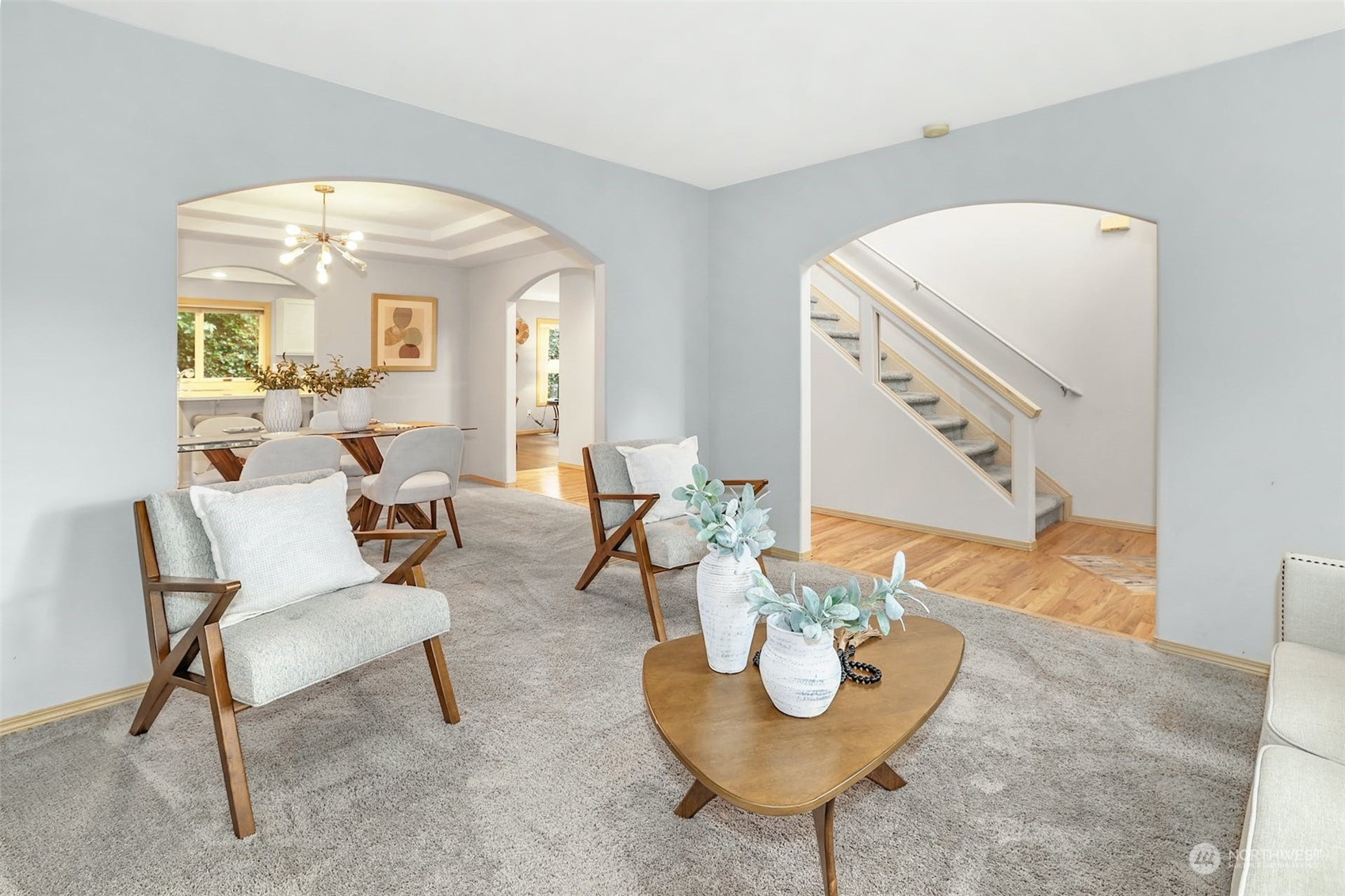 10413 Southeast 186th Place Renton, WA 98055 - Photo 7 of 34 a living room with couches and a dining table with garden view