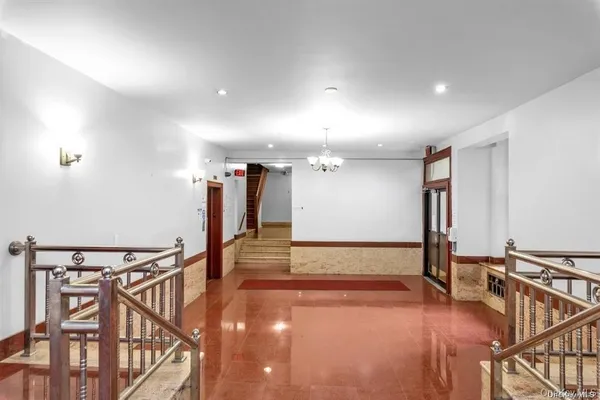 a view of a hall with wooden floor