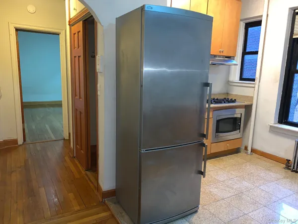 a view of a kitchen from the hallway