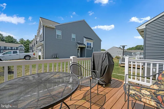 a view of a house with a backyard and a patio
