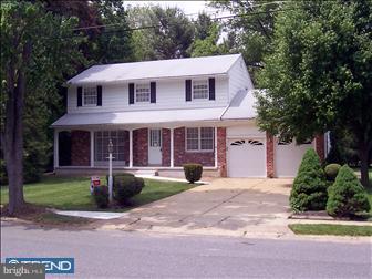 507 Wellfleet Road Cinnaminson, NJ 08077 - Photo 1 of 1 a front view of a house with a yard and potted plants