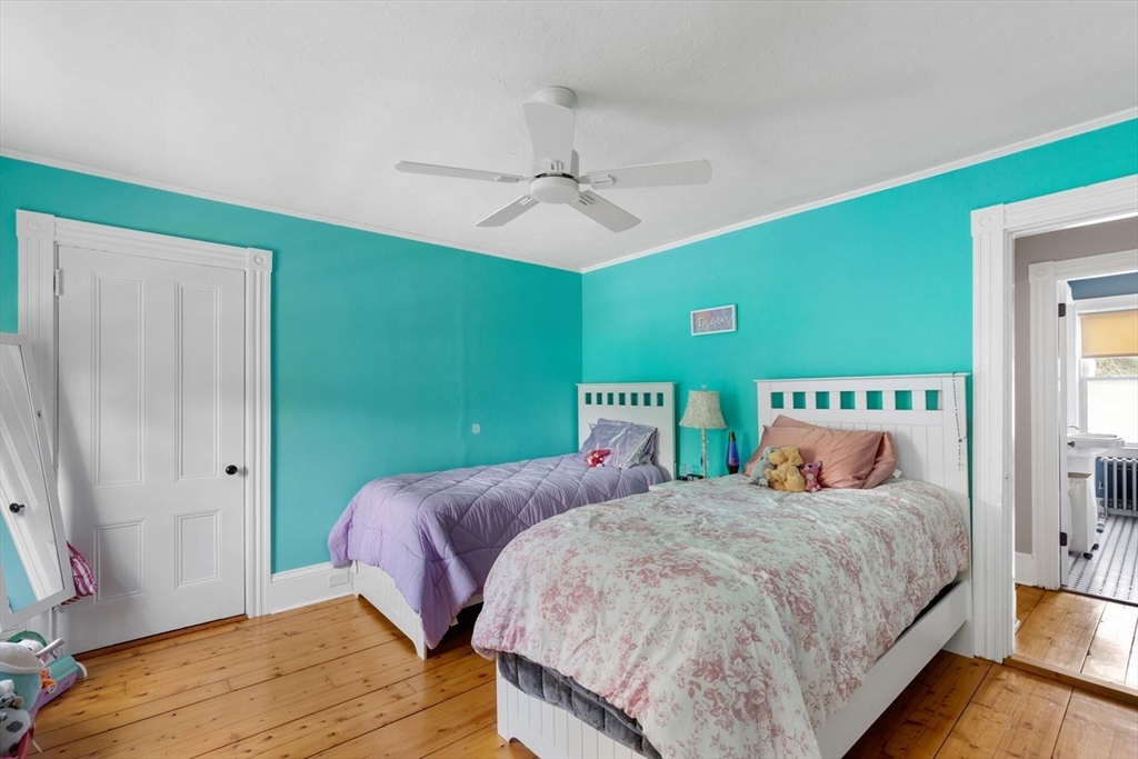 1012 Washington Street Whitman, MA 02382 - Photo 19 of 37 a bedroom with a bed and a table