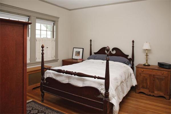 45 Margaret Road Newton, MA 02461 - Photo 4 of 6 a bed sitting in a bedroom next to a window
