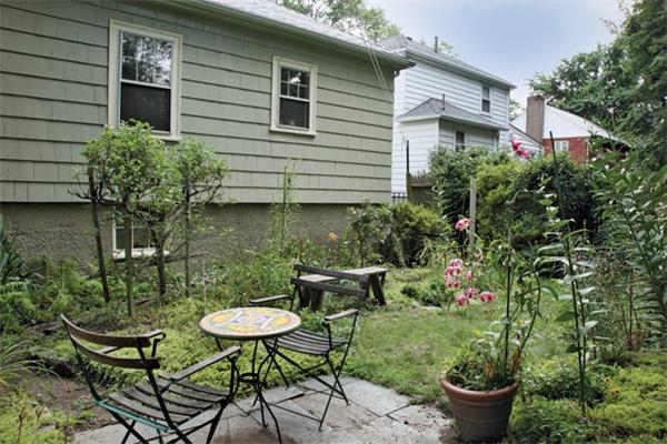 45 Margaret Road Newton, MA 02461 - Photo 6 of 6 a view of a backyard with chair and potted plants