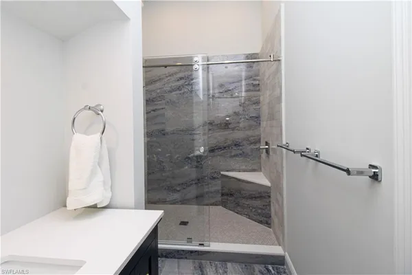 a bathroom with a sink and a shower