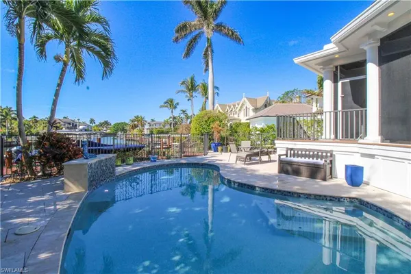 a view of a swimming pool with a patio