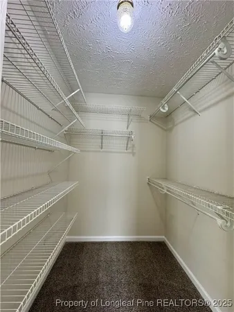 a view of a room with racks on the wall