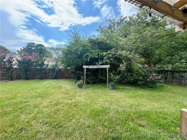 a backyard of a house with lots of green space