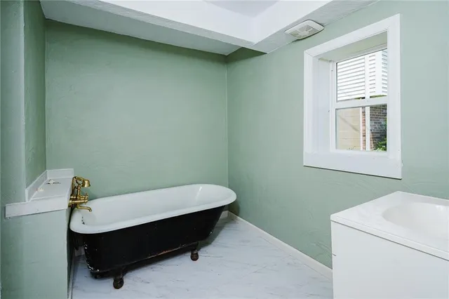 a room with a bed and a window