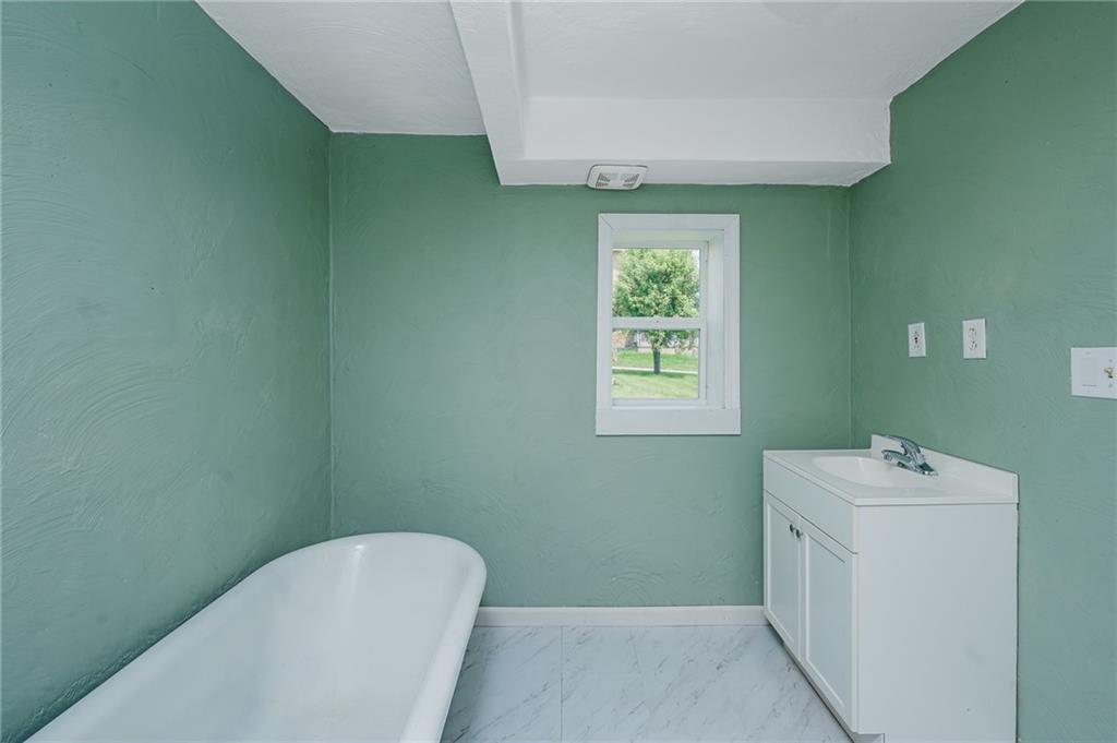 150 Penn Street Clymer, PA 15728 - Photo 13 of 38 a bathroom with a toilet sink and mirror