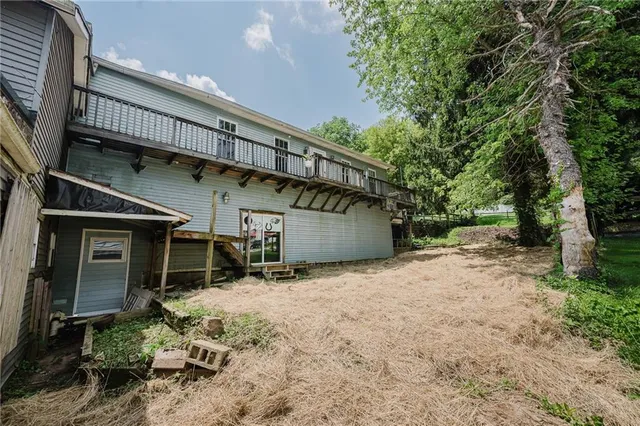 a house with trees in front of it