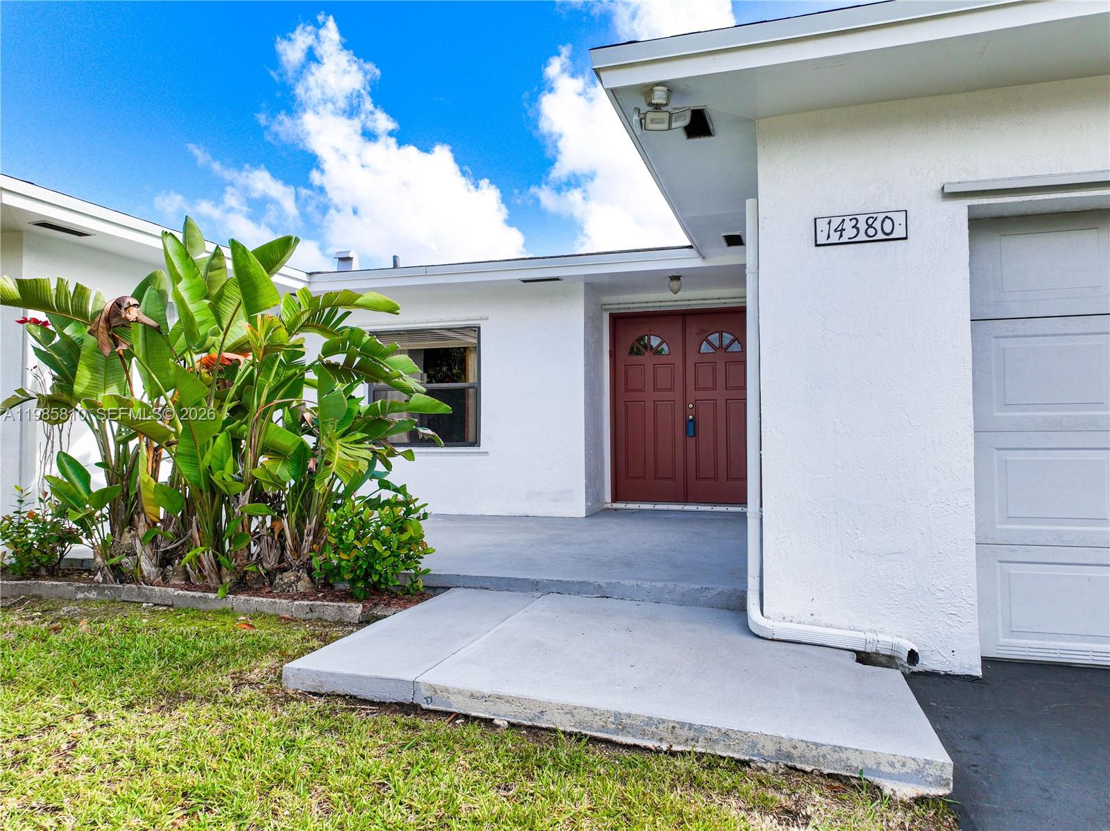 14380 Southwest 297th Street Homestead, FL 33033 - Photo 2 of 62 a front view of a house with a yard