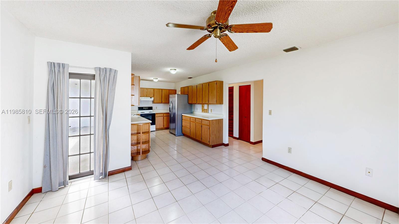 14380 Southwest 297th Street Homestead, FL 33033 - Photo 23 of 62 a view of a livingroom with furniture and a ceiling fan