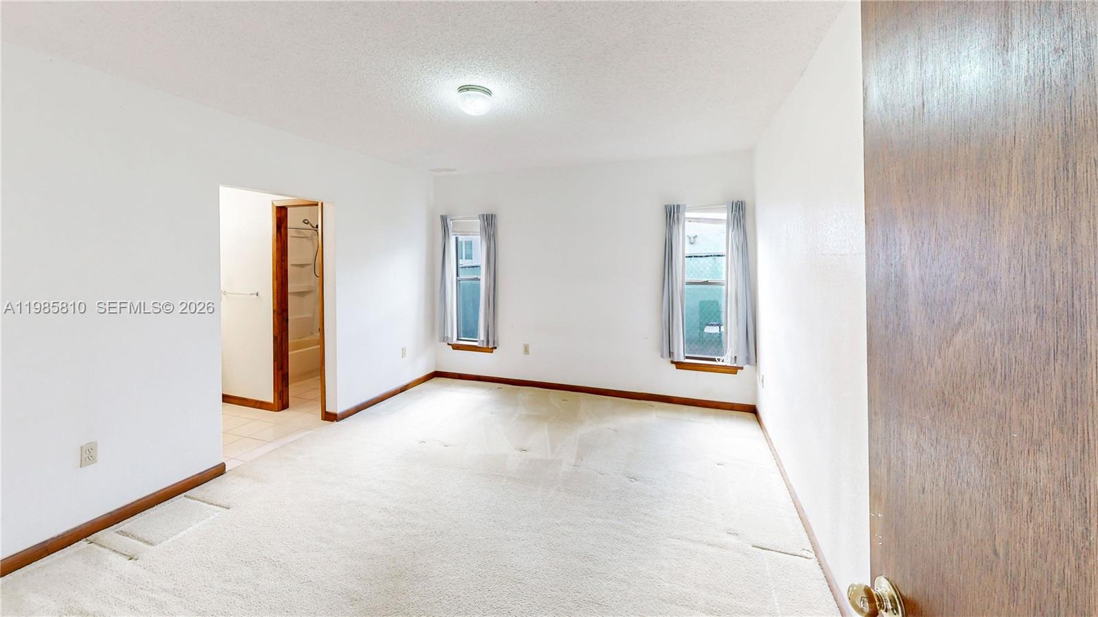 14380 Southwest 297th Street Homestead, FL 33033 - Photo 25 of 62 a view of an empty room and window