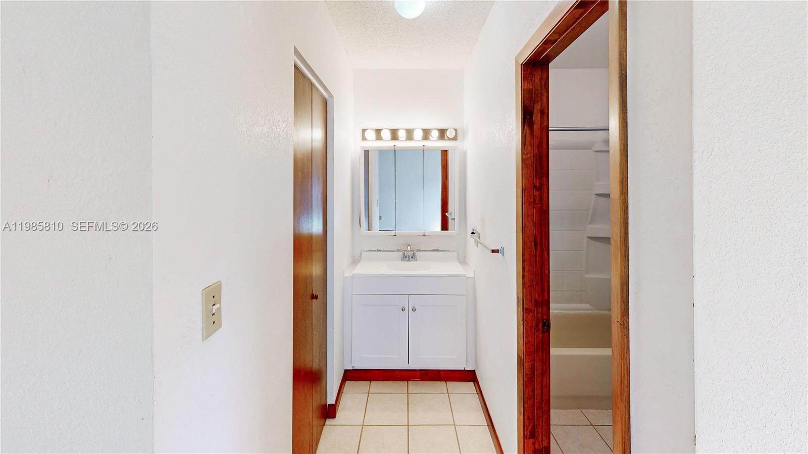 14380 Southwest 297th Street Homestead, FL 33033 - Photo 26 of 62 a bathroom with a sink and a mirror