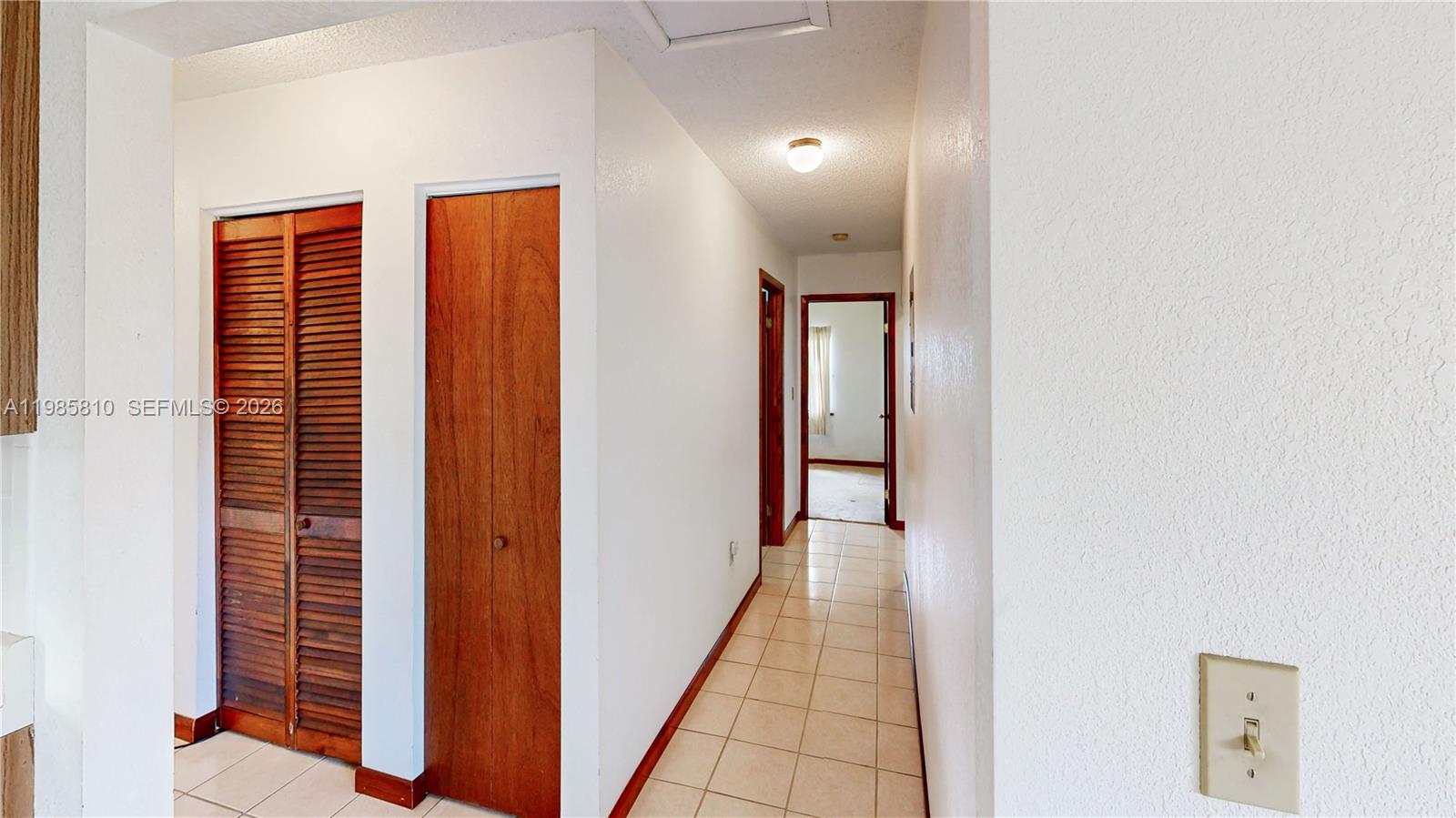 14380 Southwest 297th Street Homestead, FL 33033 - Photo 29 of 62 a view of a hallway with wooden floor