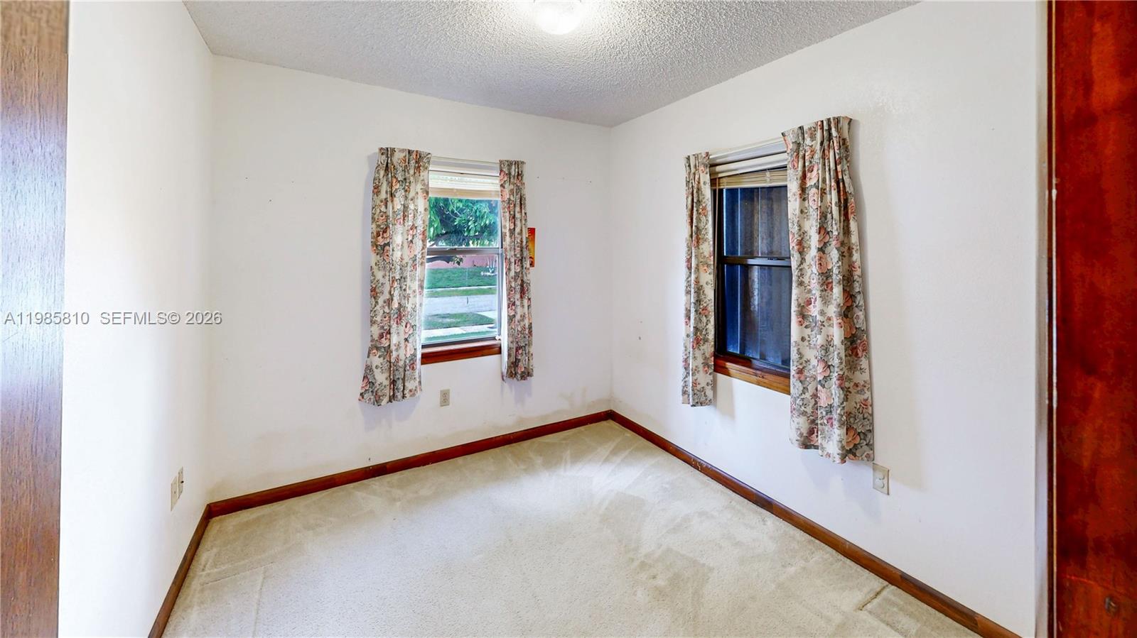 14380 Southwest 297th Street Homestead, FL 33033 - Photo 33 of 62 wooden floor in an empty room with a window