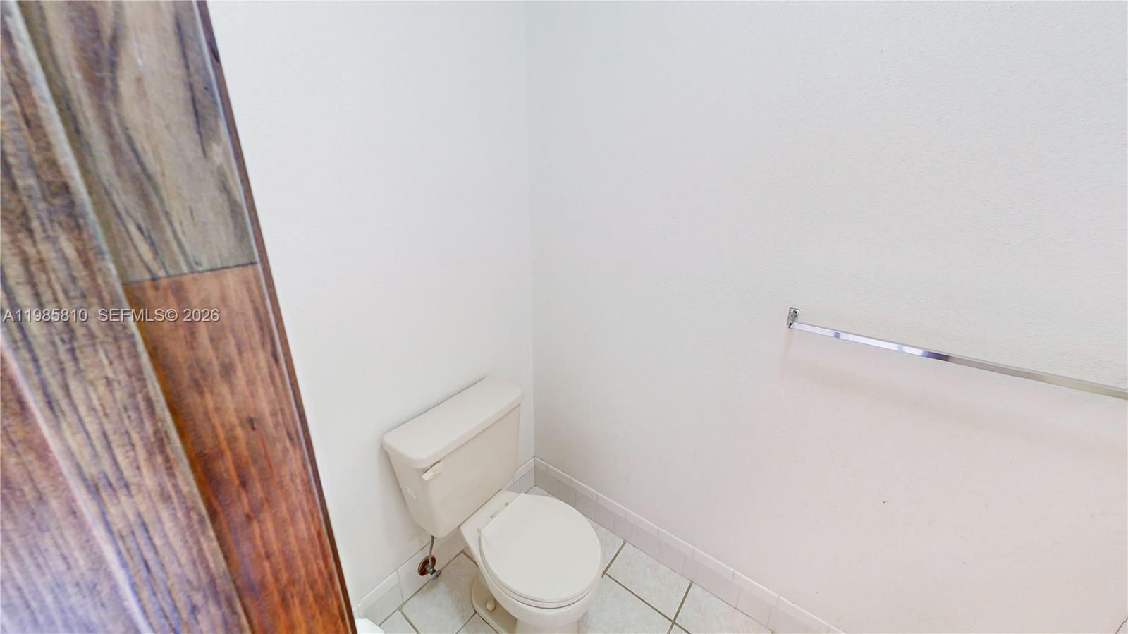 14380 Southwest 297th Street Homestead, FL 33033 - Photo 38 of 62 a white toilet sitting next to a shower