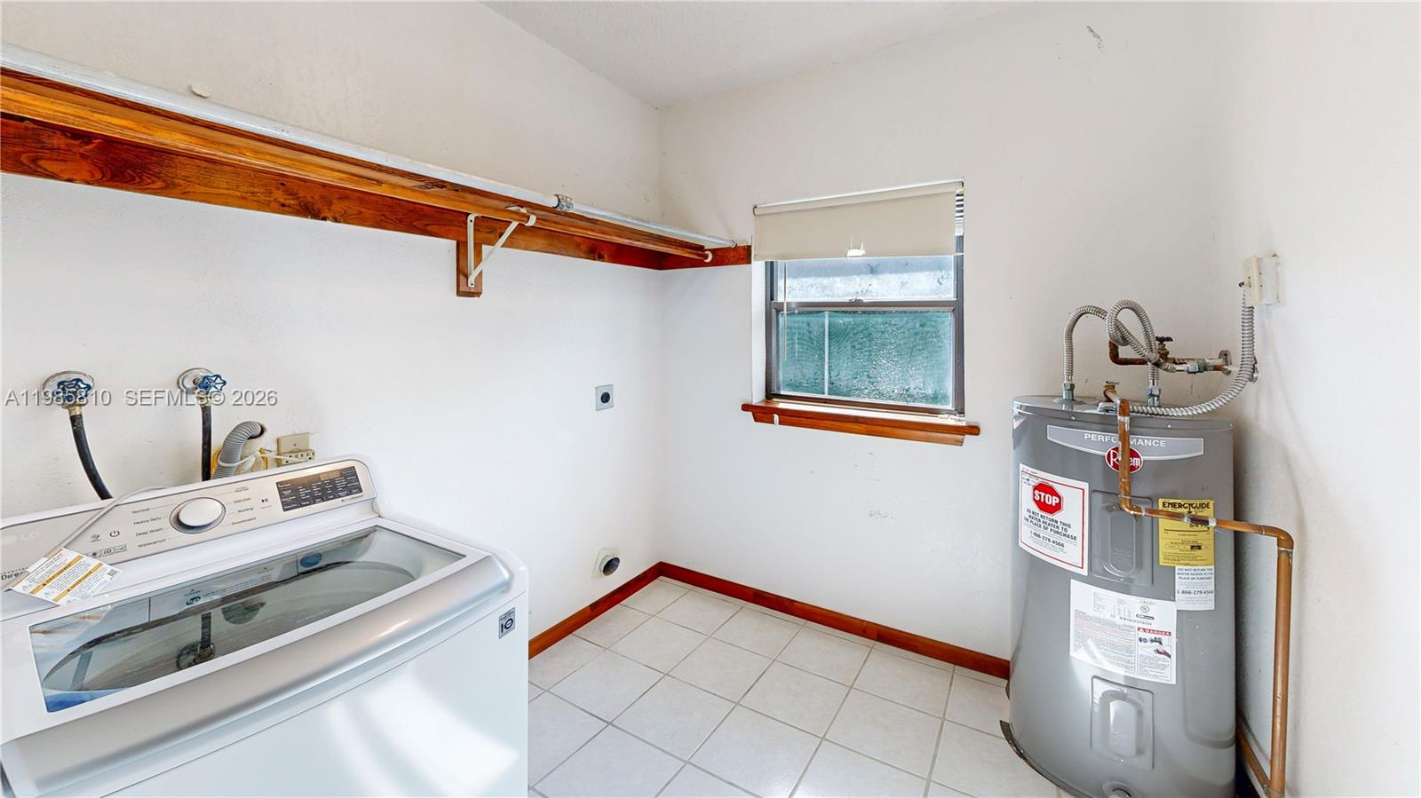 14380 Southwest 297th Street Homestead, FL 33033 - Photo 41 of 62 a utility room with dryer and washer