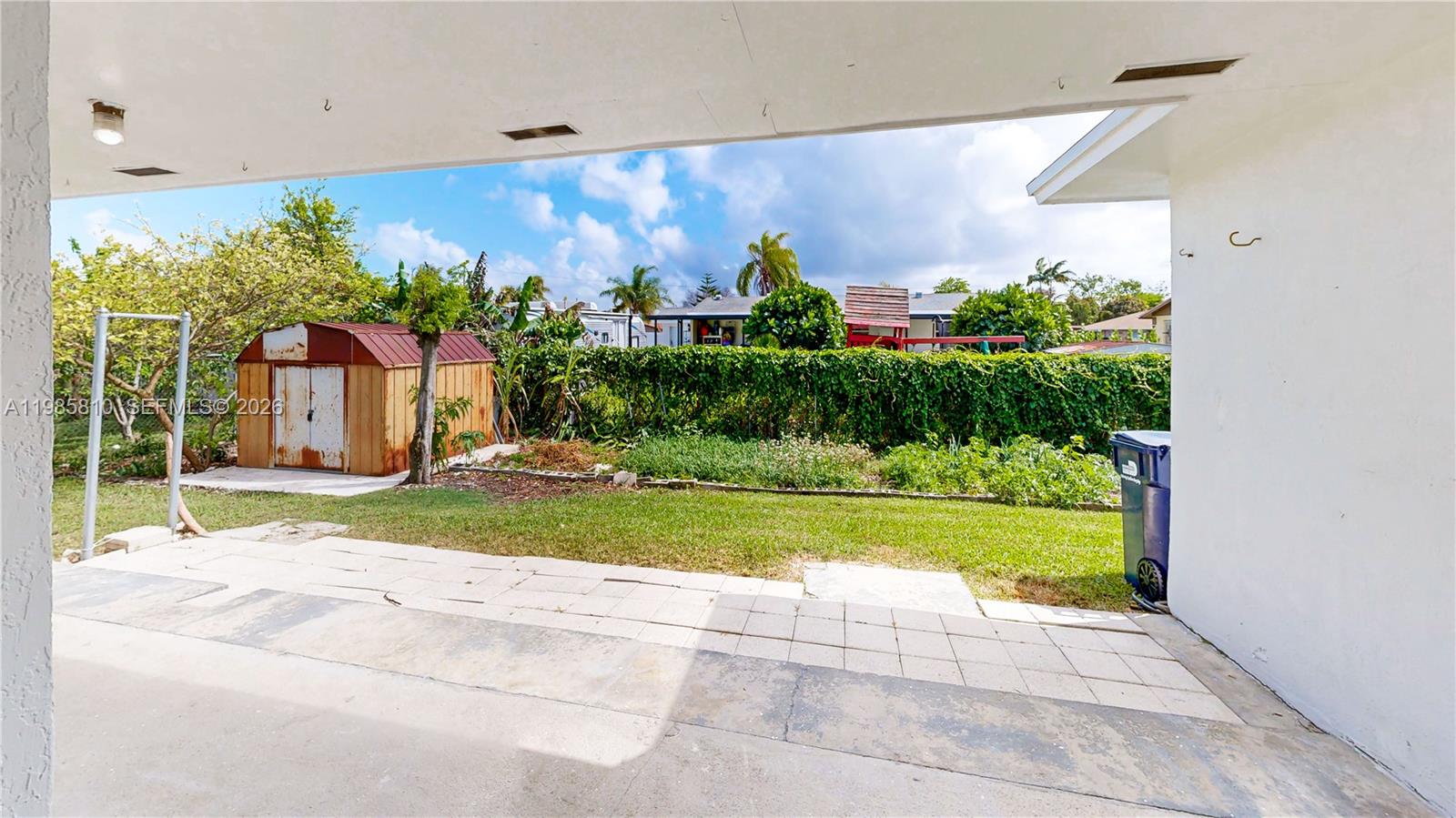 14380 Southwest 297th Street Homestead, FL 33033 - Photo 42 of 62 a view of a house with a yard and plants