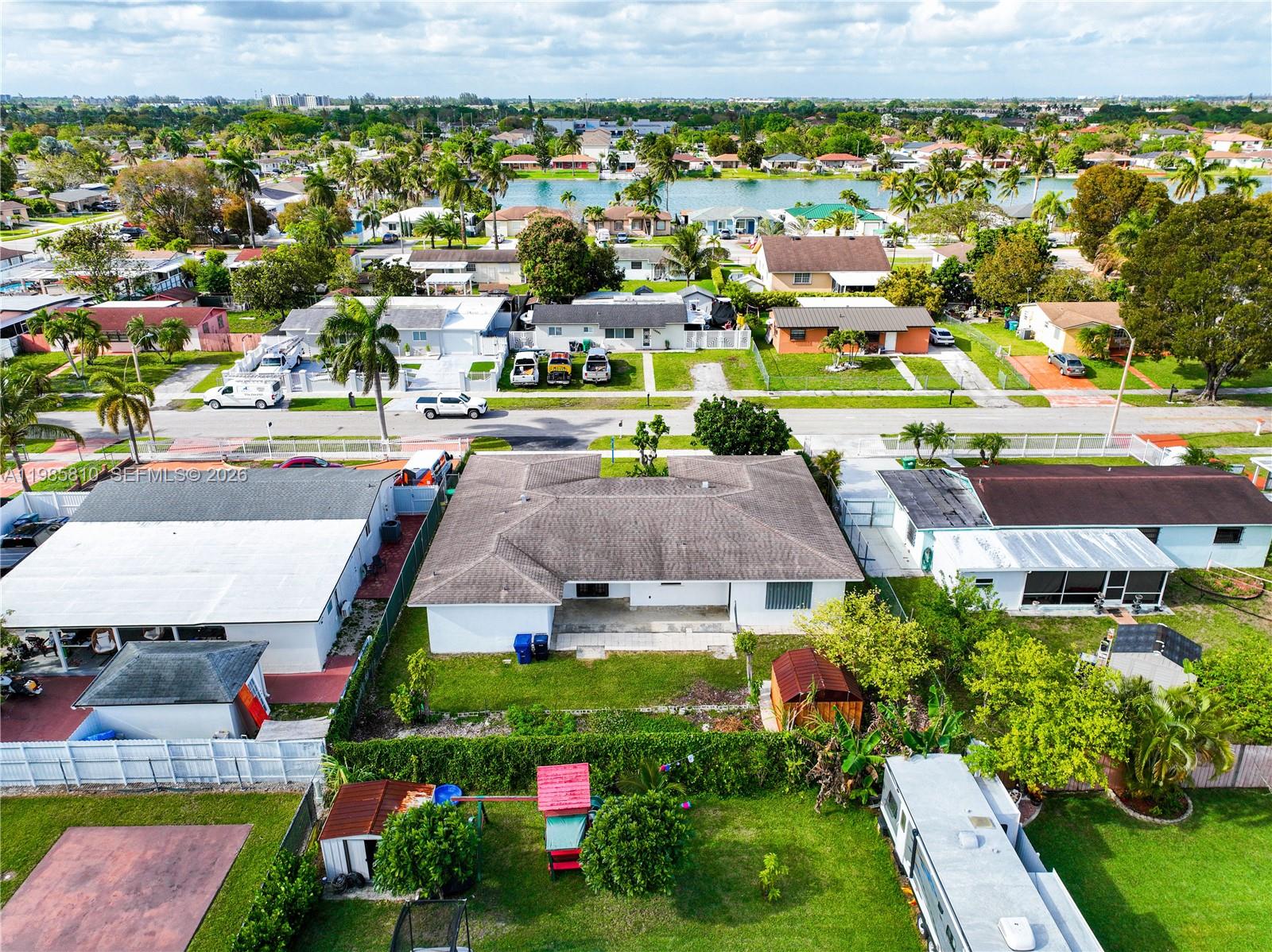 14380 Southwest 297th Street Homestead, FL 33033 - Photo 52 of 62 an aerial view of residential houses with outdoor space and street view