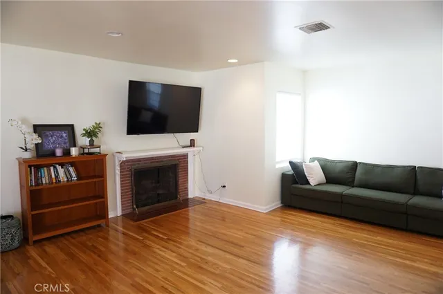 a kitchen with stainless steel appliances granite countertop a sink a stove top oven a counter space and cabinets