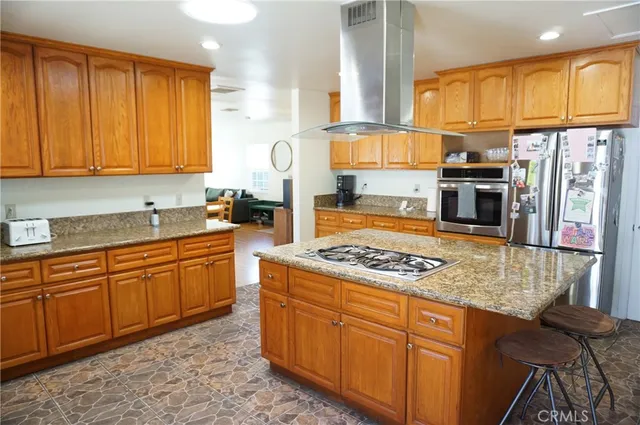 a view of a house with a yard and potted plants