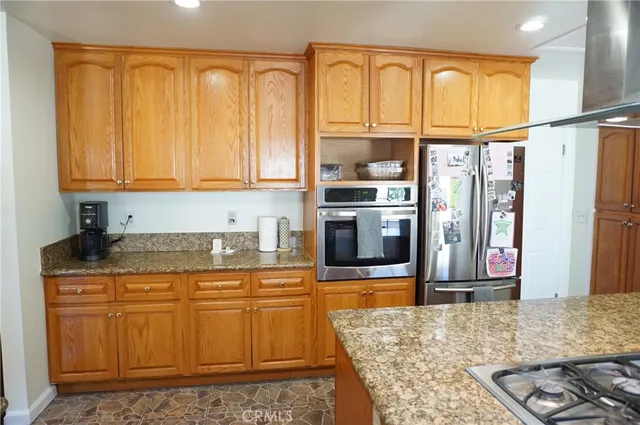 a bathroom with a sink vanity granite and a mirror
