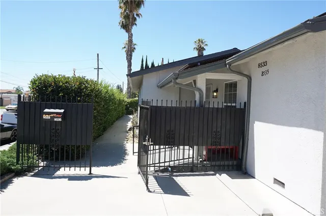a front view of a house with parking