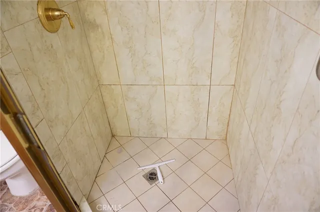 a bed sitting in a bedroom next to a wooden floor