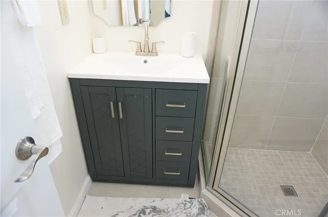 a bathroom with a sink and a mirror