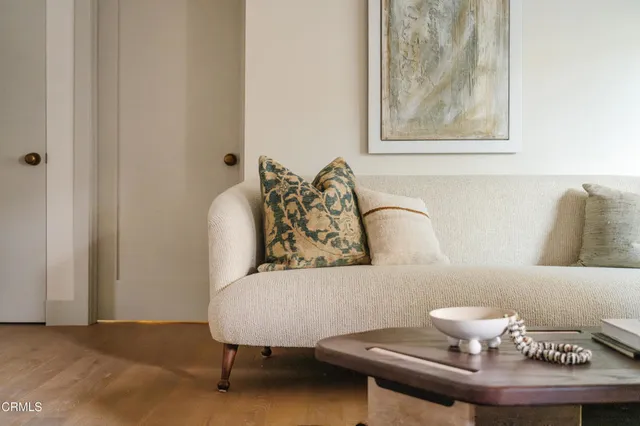 a living room with furniture and a couch