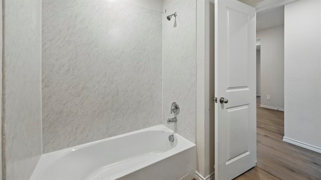 506 Lantana Road Princeton, TX 75407 - Photo 2 of 35 a white bath tub sitting next to a shower