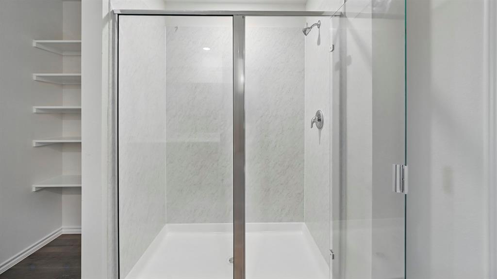 506 Lantana Road Princeton, TX 75407 - Photo 5 of 35 a bathroom with a shower and a glass door