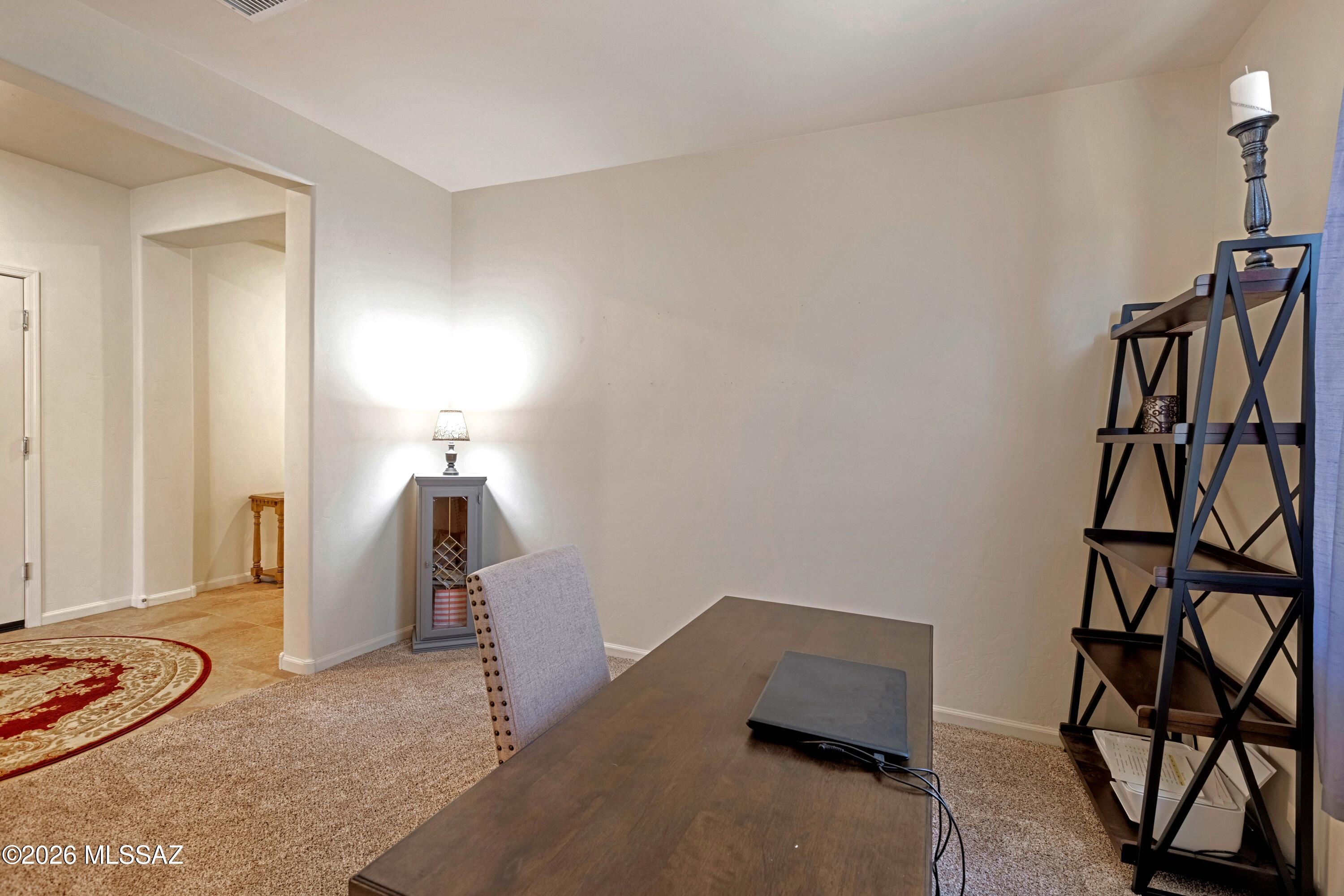 61193 East Shale Road Oracle, AZ 85623 - Photo 22 of 50 a room with furniture and white walls