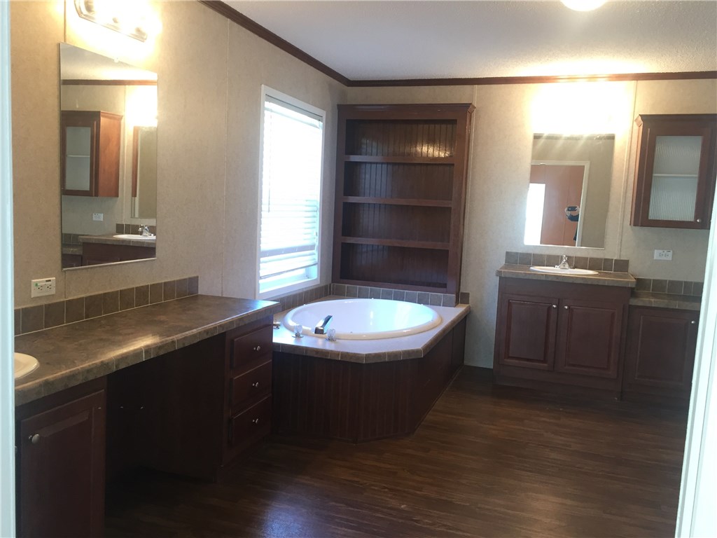 35611 Quail Road Callahan, FL 32011 - Photo 12 of 22 a bathroom with a sink a toilet and mirror